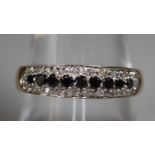 9ct gold black and white diamond ring. Size O&1/2. Approx weight 1.8 grams. (B.P. 21% + VAT)