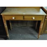 Victorian style pine two drawer side table/wash stand on tapering ring-turned legs. (B.P. 21% + VAT)
