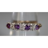 9ct gold diamond and purple stone half eternity style ring. Ring size M. Approx weight 1.8 grams. (