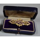 9ct gold brooch with stamped and applied decoration of engraved hearts and flowers. Approx weight