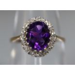 9ct gold oval amethyst and diamond ring. Ring size M. Approx weight 2 grams. (B.P. 21% + VAT)