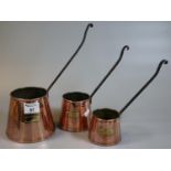 Graduated set of three conical copper cider measures with iron handles. (3) (B.P. 21% + VAT)