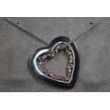 Clogau Silver heart pendant with gold highlights on 18 inch chain. (B.P. 21% + VAT)