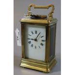 French brass carriage clock with full depth Roman face. (B.P. 21% + VAT) Lacks original gilding,