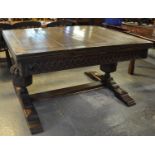 Early 20th Century oak draw leaf dining table, the moulded top above carved frieze panels, large