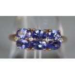 9ct gold Tanzanite cluster ring stamped 10K. Ring size O & 1/2. (B.P. 21% + VAT)