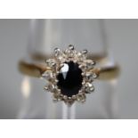 9ct gold sapphire and diamond cluster ring. Ring size M. Approx weight 2.4 grams. (B.P. 21% + VAT)