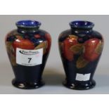 Pair of Moorcroft art pottery tube lined pomegranate vases of baluster form, 10cm high approx,