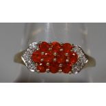 9ct gold diamond and orange stone cluster ring. Ring size R. Approx weight 2.4 grams. (B.P. 21% +