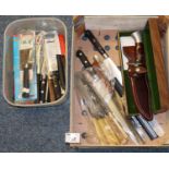 Crate of oddments to include kitchen knives and other cutlery, Westmark knife in scabbard, etc. (B.
