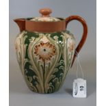 Moorcroft Macintyre Florian single handled lidded teapot of baluster form, tube lined decoration