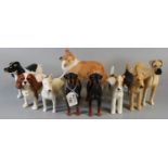 Beswick - a collection of nine dog figures to include; 'Cast iron Monarch' and 'Talavera Romulus