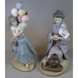 Two Lladro Spanish porcelain figurines; one of an oriental lady drinking her tea, the other a