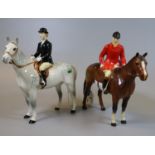 Beswick huntsman/woman on dapple grey horse, together with another Beswick horse with huntsman in