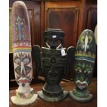 Three carved wooden totem type polychrome decorated masks. Possibly modern south seas. 69 cm