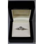 18ct white gold and diamond halo ring. Size L. Approx size L Approx weight 3 grams. (B.P. 21% + VAT)