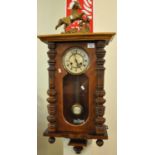 Early 20th Century walnut two train Vienna type wall clock having carved rearing horse pediment,