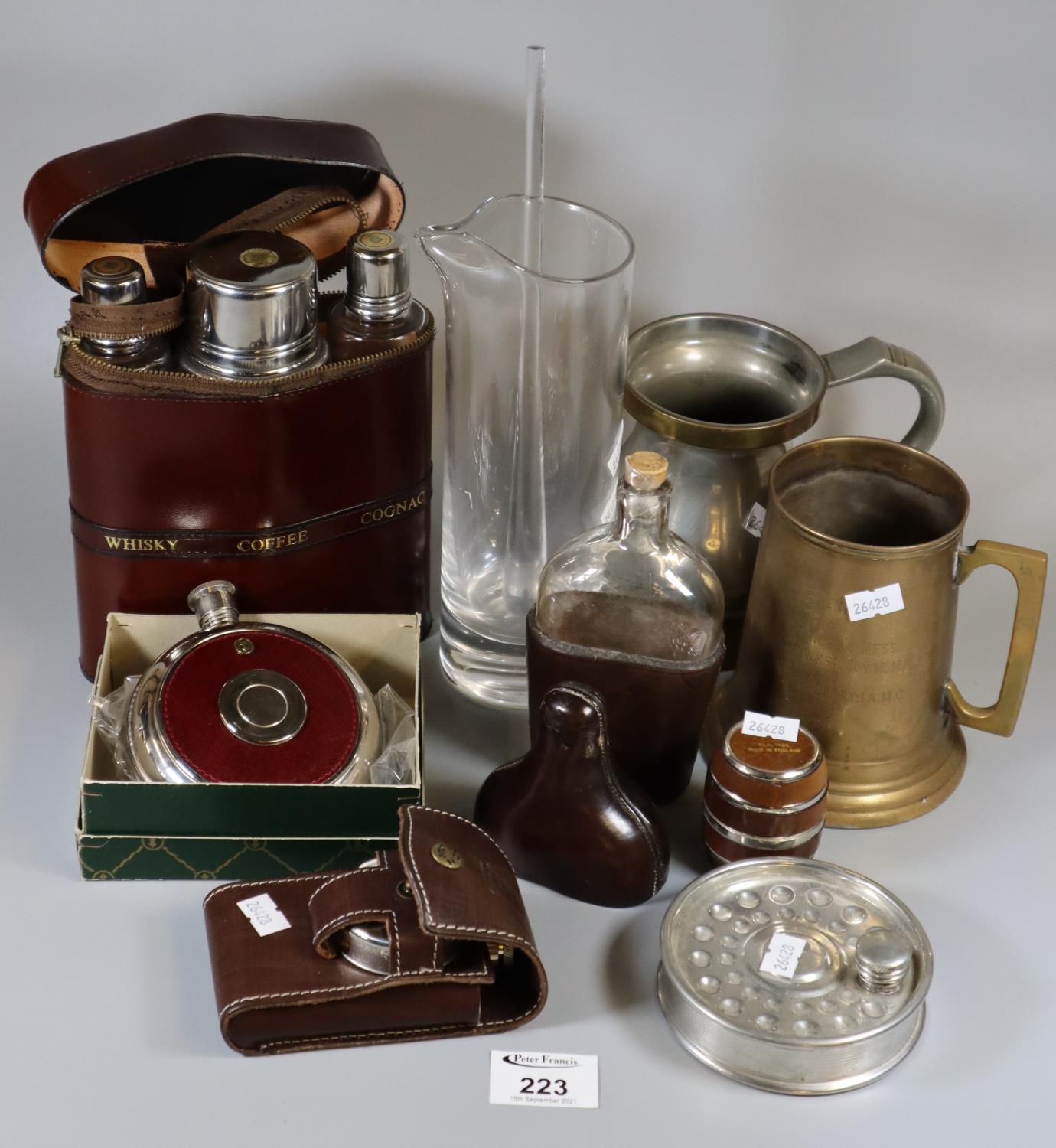 Plastic tray of oddments to include tankards, leather and glass hipflask, hipflask in the form of