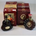 Three cognac Hennessy X.O bottles in original boxes, 70cl. Together with two Remy Martin Centaure