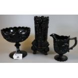 Three Victorian slag glass items to include; pedestal bowl, cream jug and spill vase, decorated with