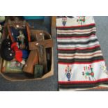 Box of assorted items to include; a woollen wall hanging in Peruvian style, two Gollywogs, a tin