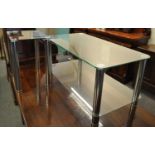 Modern glass top coffee table/TV stand with matching lamp table on chrome finish supports. (2) (B.P.