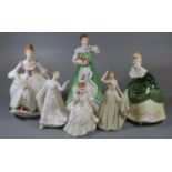 Six Royal Doulton bone china figurines, various, to include; 'Merry Christmas', 'Country Rose',