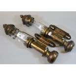 Pair of brass wall-mount candle holders with glass lenses. Marked GWR. 30 cm high approx. (2)