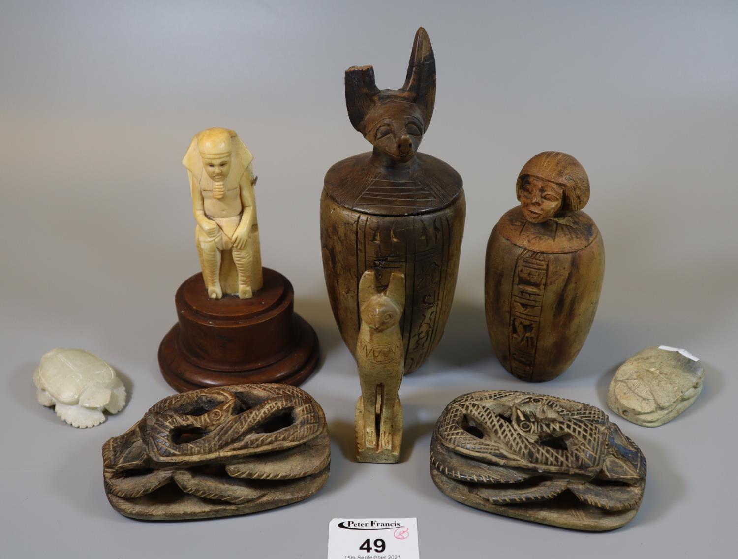 Group of modern tourist type Egyptian style creatures and objects including scarab beetle,