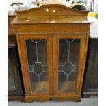 Early 20th Century oak two door lead glazed bookcase or display cabinet with adjustable shelves. (