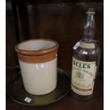 Large Bell's whiskey bottle, together with a stoneware cylindrical jar and a brass Middle Eastern