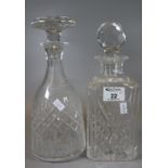 Two cut glass decanters of square section and hob nail form with faceted and mushroom stopper. (