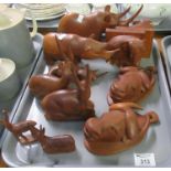 Tray of assorted wooden animal studies to include; elephant bookmarks, carved wooden bison heads,