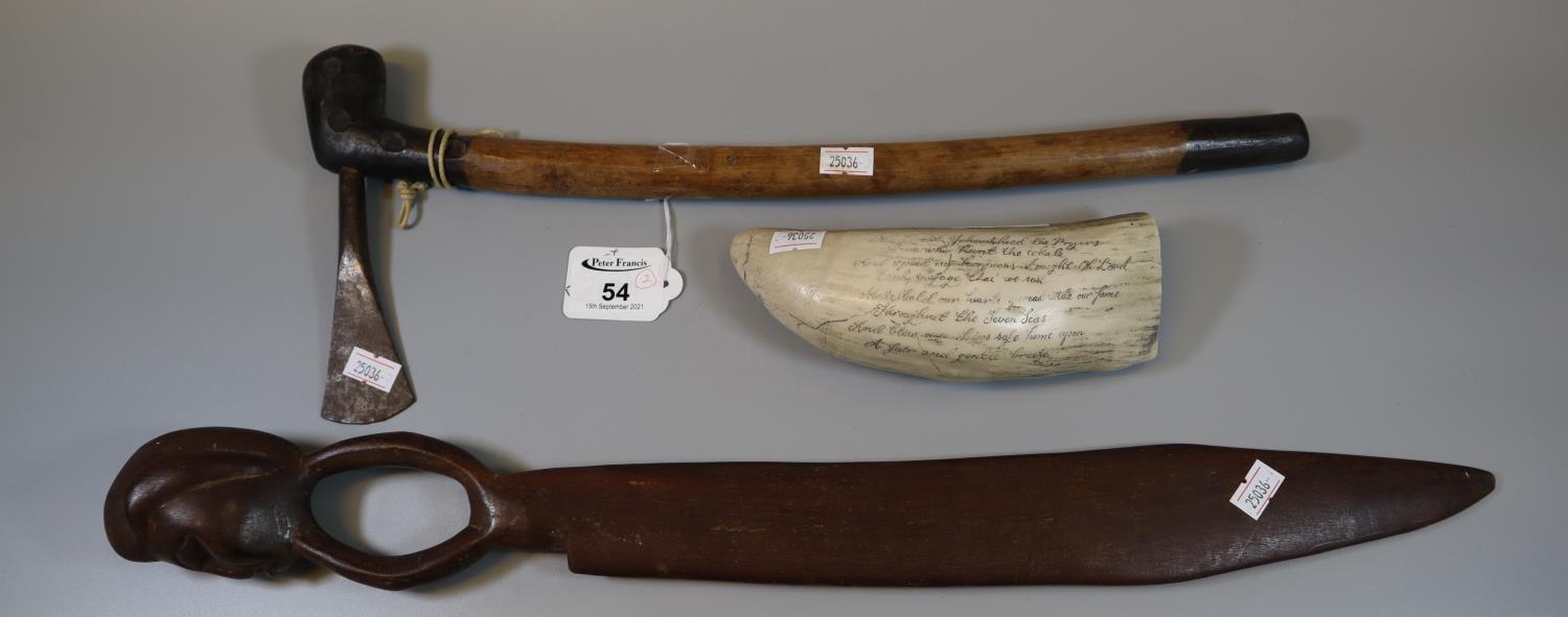 African iron 'Lozi' axe, together with a figural wooden knife and a 'Scrimshaw' resin whale's