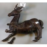 Chinese patinated bronze study of a deer or stag with relief and incised scroll decoration. 32 cm