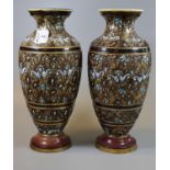 A pair of late 19th Century Doulton Lambeth stoneware vases of baluster form with painted stylised