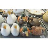 Two trays of assorted animal shaped items to include; various china egg crocks in the shape of birds