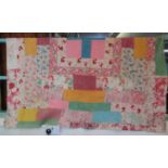 Colourful vintage patchwork cotton quilt with patches in various fabrics both floral and plain. (B.