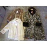 Two vintage fur bomber jackets; one a cream colour and the other a brown coney fur. Together with