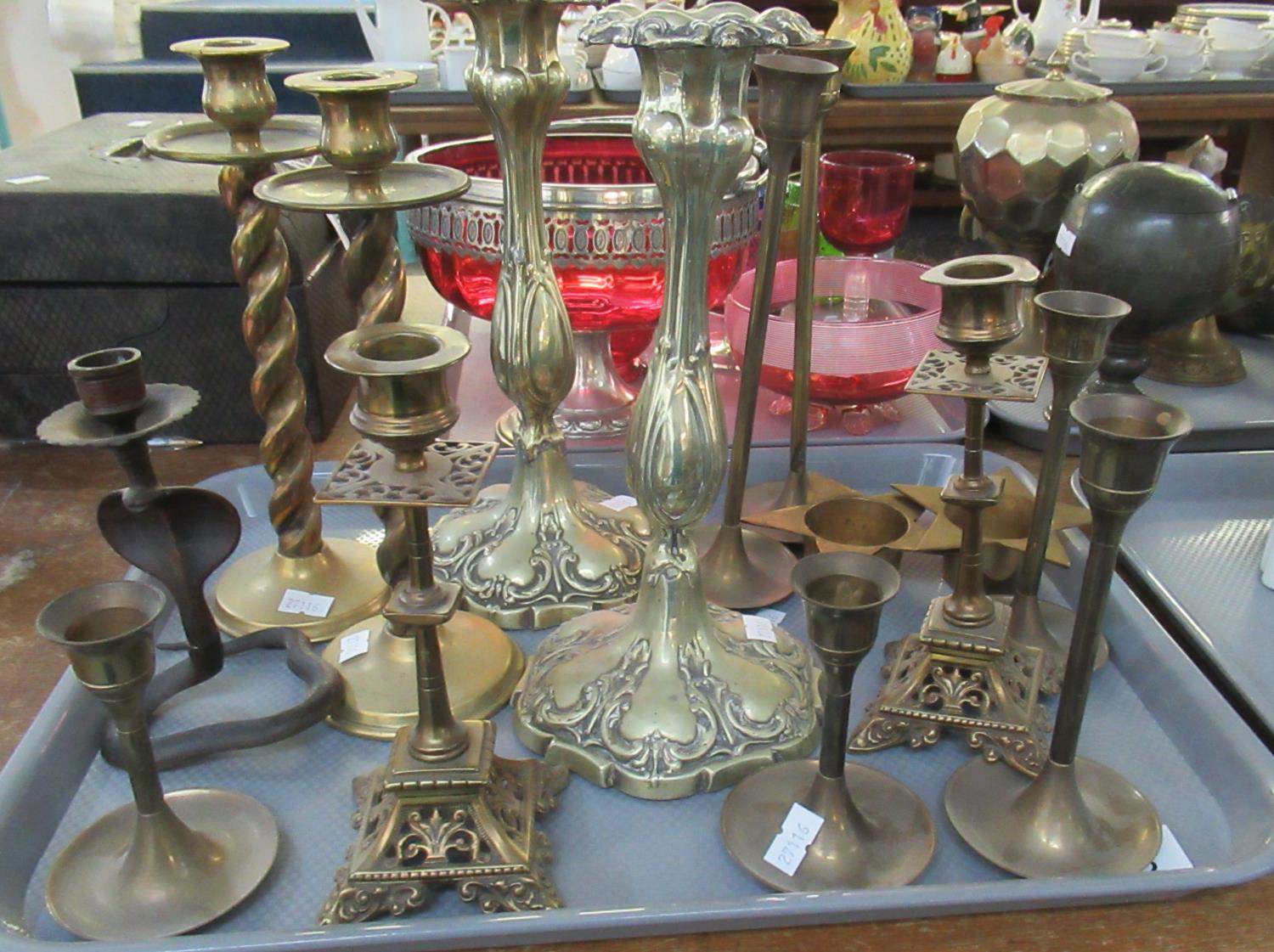 Tray of assorted brass candlesticks to include; various pair of decorative and plain, one single