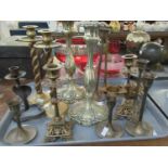 Tray of assorted brass candlesticks to include; various pair of decorative and plain, one single