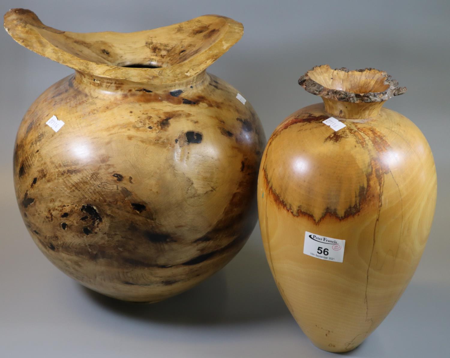 Large baluster-shaped spalted sycamore vase, signed John de Filippo. With a similar tapering