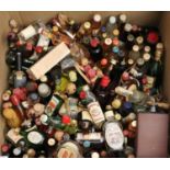 Box containing a large collection of alcoholic miniature spirits to include; rum, vodka, whisky,
