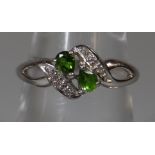 9ct white gold set with two pear shaped green gemstones and diamonds. Ring size M. Approx weight 2.7