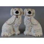 Pair of Beswick pottery fireside dogs with painted features. (B.P. 21% + VAT)