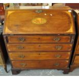 Edwardian mahogany inlaid slope front bureau having shell and fan inlay above four long drawers on a