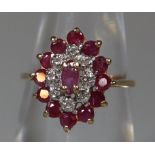 9ct gold ruby and diamond oval cluster ring. Ring size I. Approx weight 2.2 grams. (B.P. 21% + VAT)