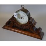 19th century brass drum shaped barometer with thermometer, unnamed, on a carved oak scrolled and