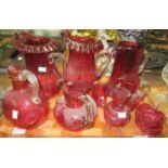 Tray of cranberry glass: pair of fluted edge cranberry glass jugs and three others with a