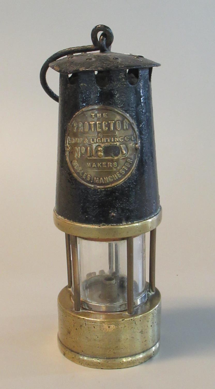The Protector Lamp & Lighting co. of Eccles, Manchester brass miners safety lamp in used